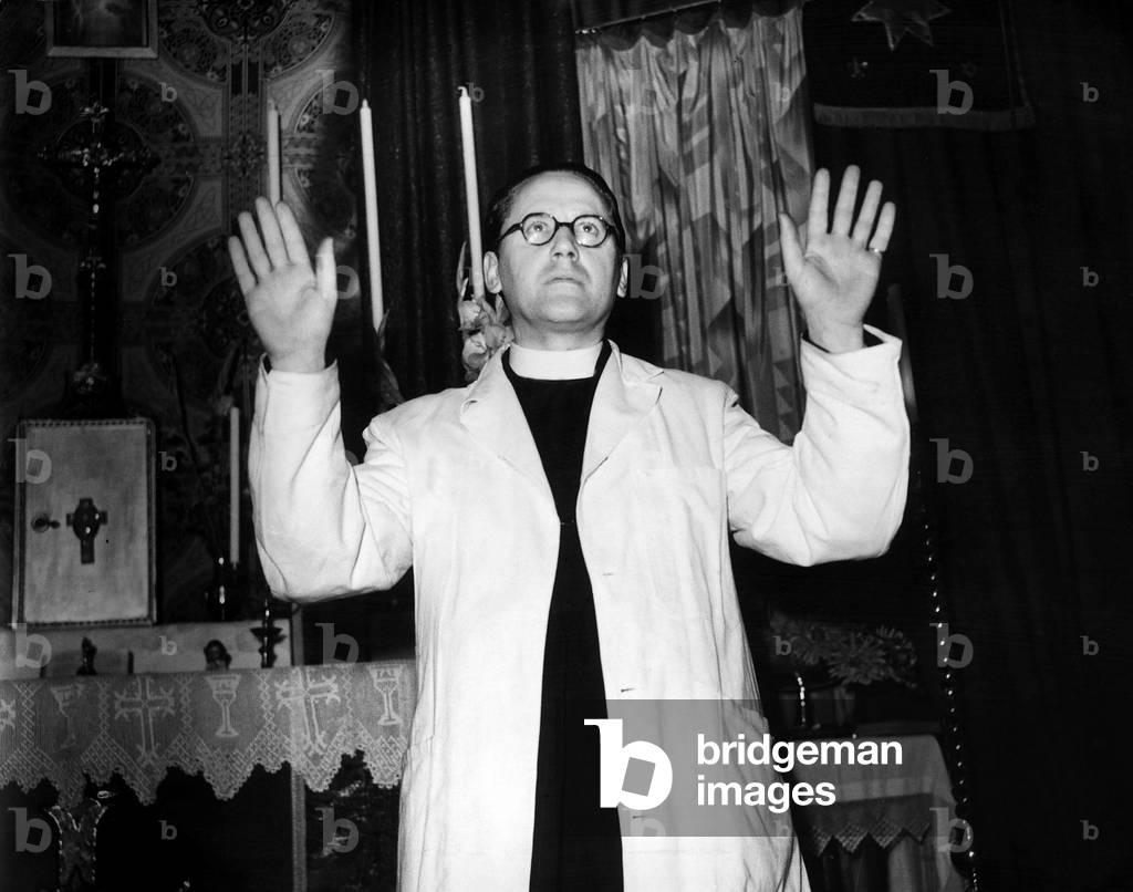 Father Harold Nicholson In a bombed church in Sloane Square, 19/09/1948 (b/w photo)