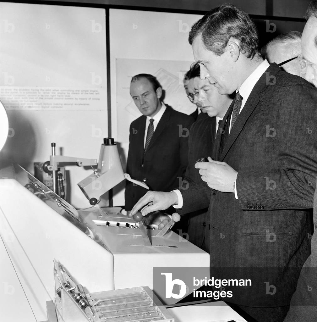 Mr. Anthony Wedgwood Benn tours the Lucas factory at Burnley. . . . The Minister at the controls of an Electronics Simulator which sorts out the problems of Gas Turbines. Minister for Technology, Mr. Anthony Wedgwood Benn and Mr. S. R. Jackson, Director of the Lucas Company discuss the latest in jet engines during his tour of the Lucas factory at Burnley, Lancs. January 1970