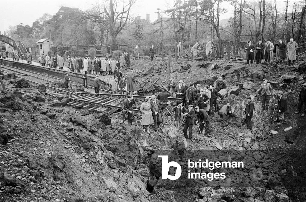 V2 Rocket incident near Palmer's Green Station. Crater made by the rocket after the explosion. 7th November 1944 (b/w photo)