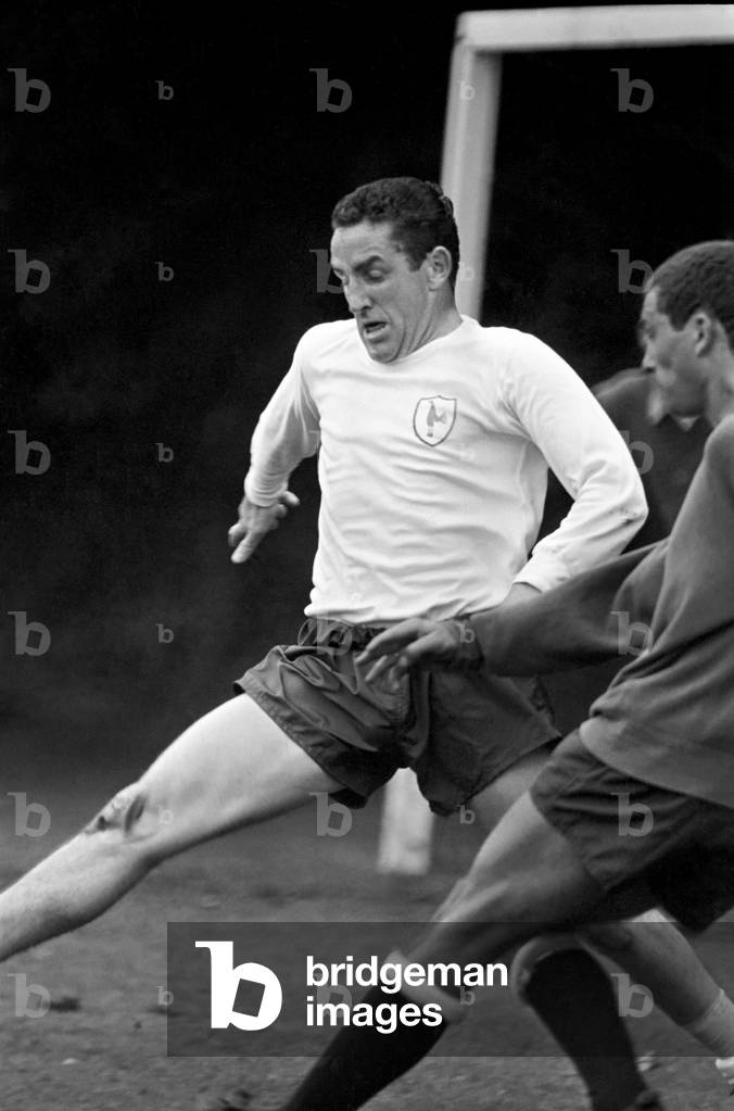 Members of the Tottenham Hotspur team training. Dave Mackay practices his tacklingJuly 1965 1965-1971-040 (photo)
