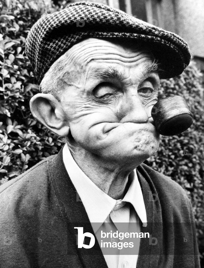 One of the faces of champion gurner Dai Llewellyn, of Mountain Ash, now aged 82 but gurning as well as ever 
August 1978