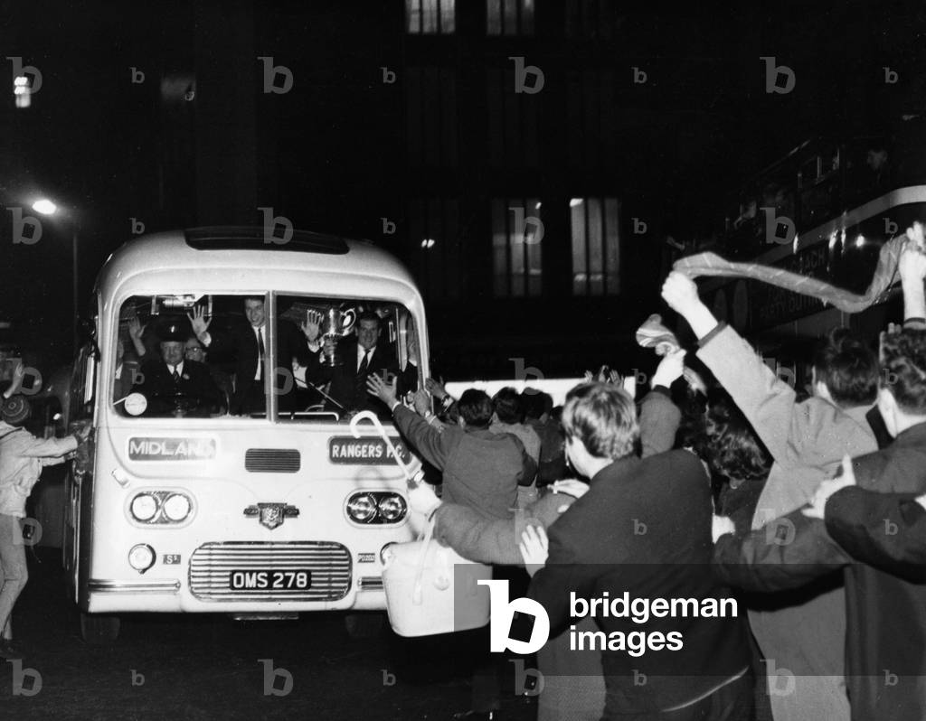 Cheering fans greet victorious Rangers players bus in St Enoch Square after FA Cup Final Replay against Celtic 15th May 1963. Shearer, holding the cup, and Henderson can be seen at front of the busFinal score: Rangers 3-0 Celtic (Replay) (photo)