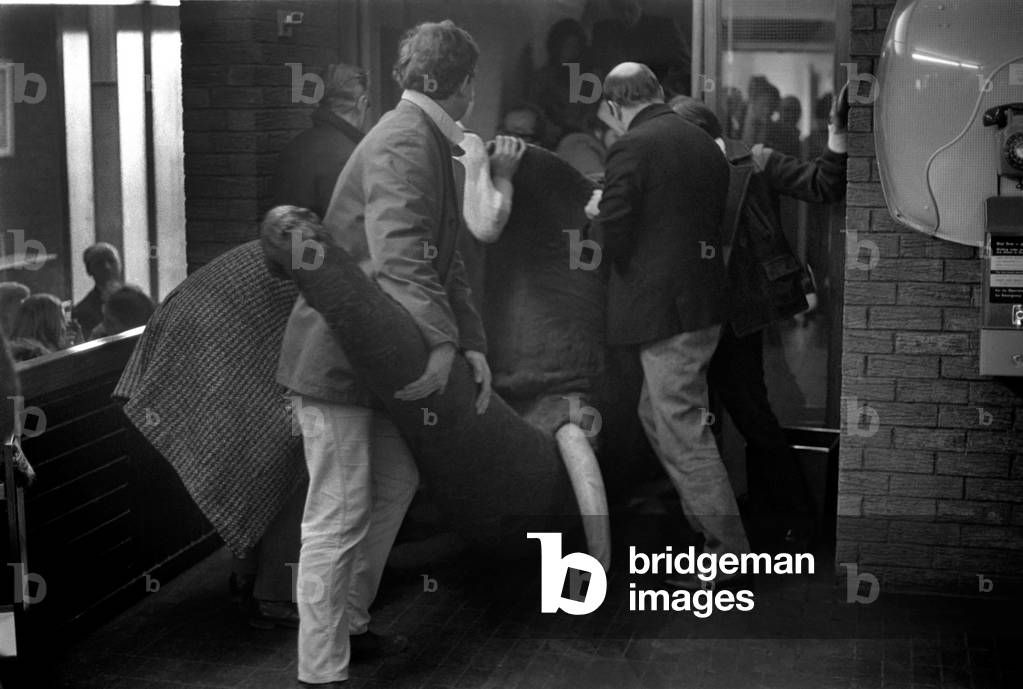 Animals: Humour: Members of the Octagon theatre, Bolton during scenes for a film using an Elephant. December 1969