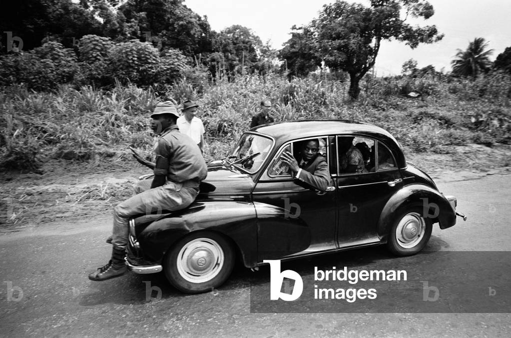 Pictures taken during the Daily Mirror's attempt to reach the refugee camps of Onitsha and Asaba during the Biafra conflict.
Our picture shows Nigerian federal soldiers escoting local officials to the refugee camp.
16th July 1968.
