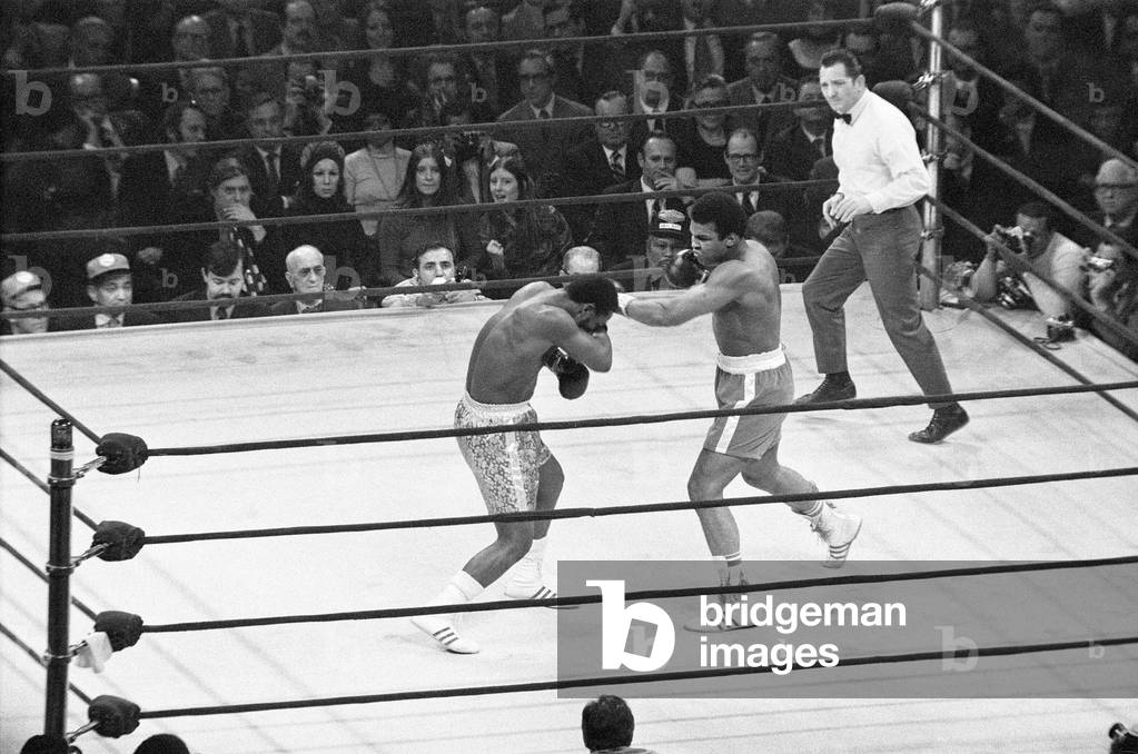 Muhammad Ali and Joe Frazier battle it out for the World Heavyweight Championship in Madison Square Garden, New York City, 8th March 1971 (b/w photo)