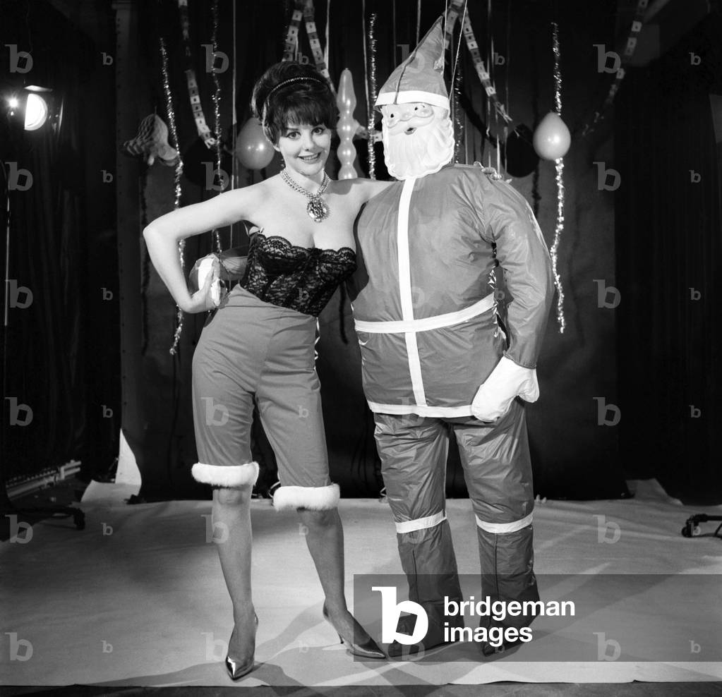 Model Kim Tracy seen here dressed for the office Christmas Party, 1960 (b/w photo)