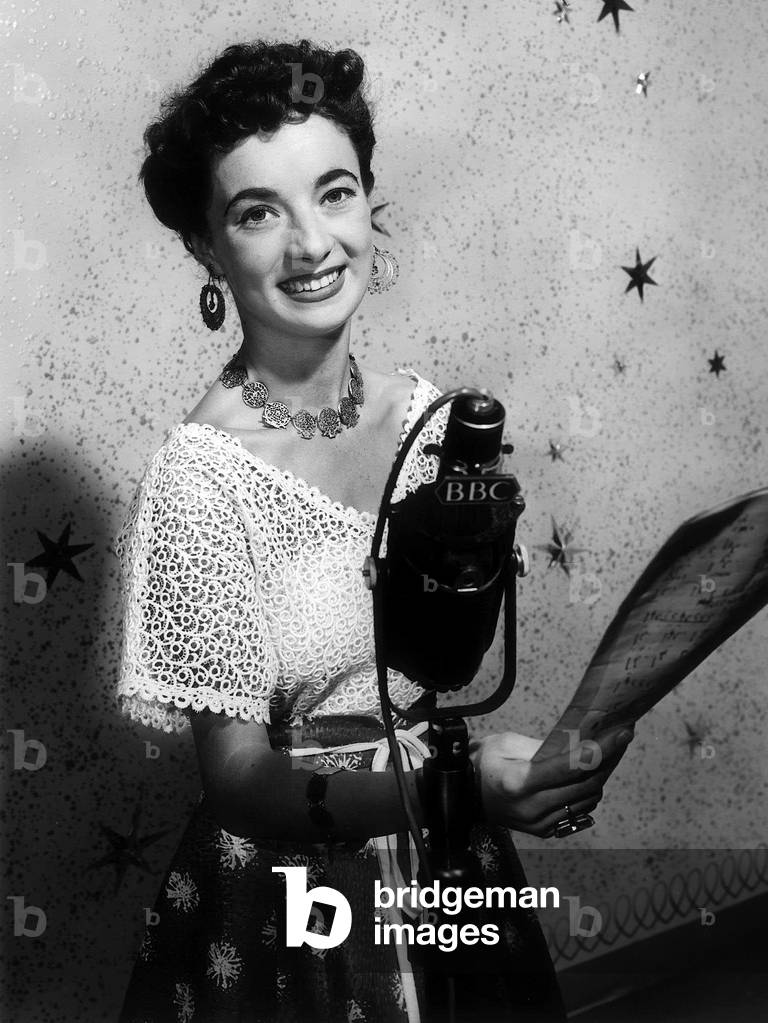 Louise Traill Actress next to a BBC microphone September 1958 (b/w photo)