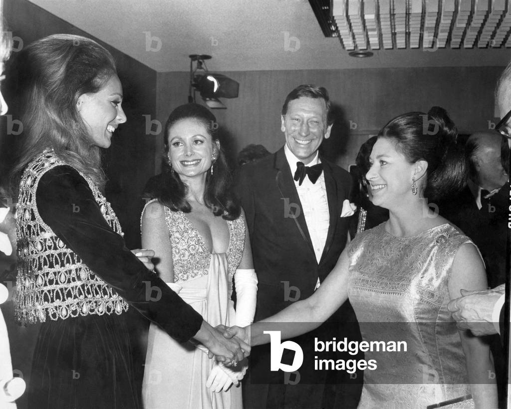 Princess Margaret shaking hands with Camilla Sparv who stars in the film. 
April 1969