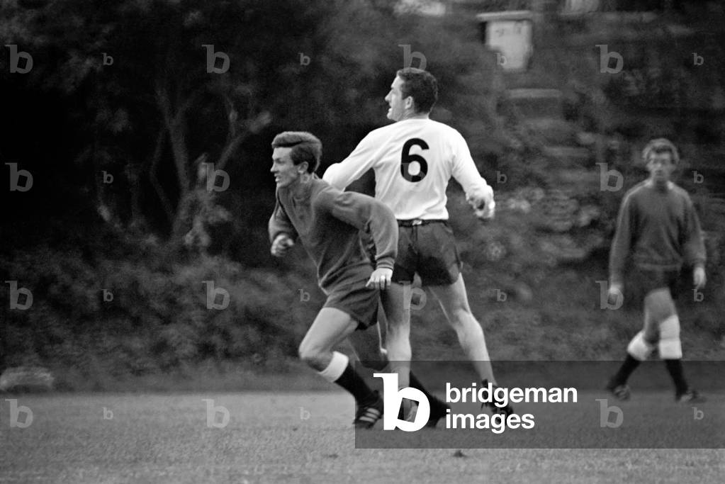 Members of the Tottenham Hotspur team training. Dave Mackay practices his tacklingJuly 1965 1965-1971-050 (photo)