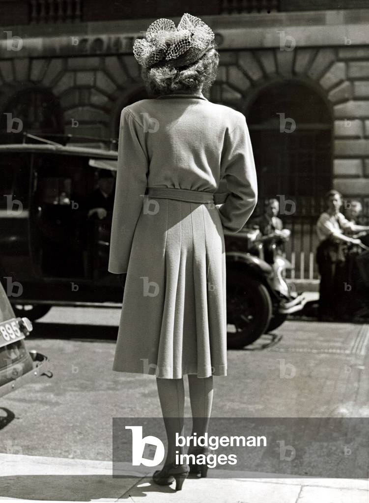 Model wearing a pleated coat with doleen sleeves, c.1940 (b/w photo)