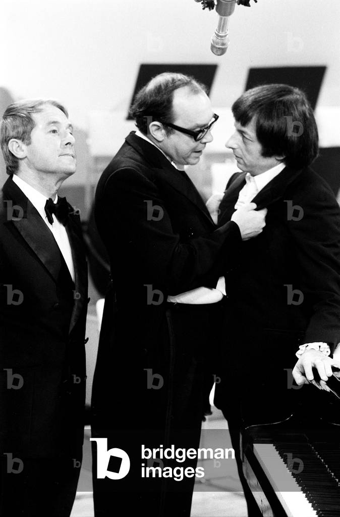 Andre Previn with Eric Morecambe & Ernie Wise during the recording of Morecambe & Wise show, 1971 (b/w photo)