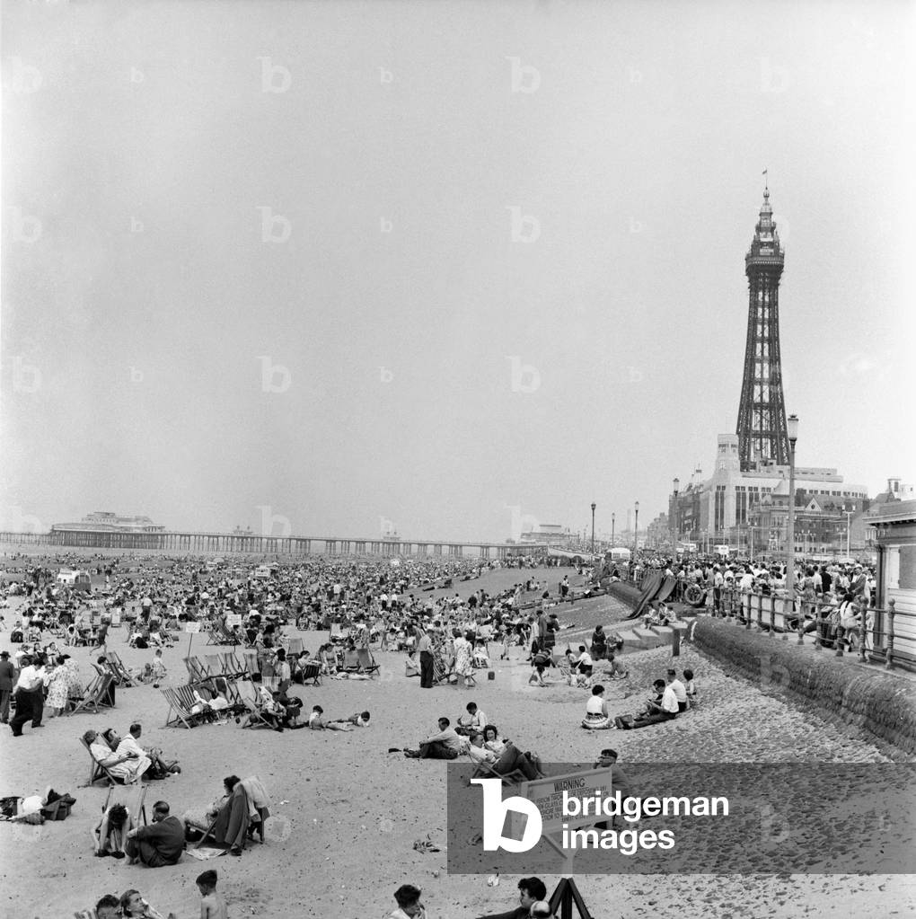 Bank holiday at Blackpool. Beach scenes/crowds/sunbathing. June 1960