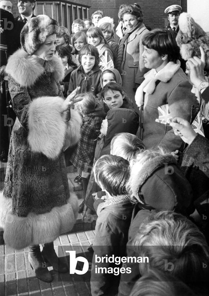 Princess Alexandra talks with teachers and children from Broad Street school after the opening ceremony in the tiny village of Cherington(population 200), near Stratford-upon-Avon. 30th November 1978 (b/w photo)