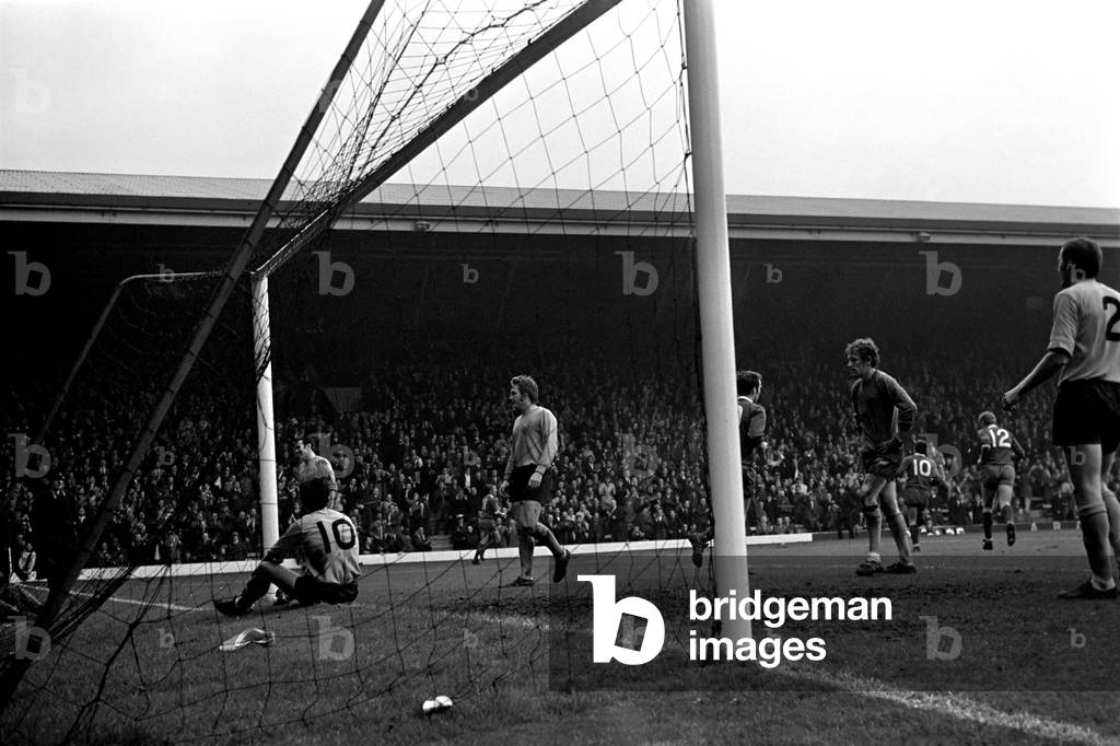 Sport: Football: Liverpool v. Southampton. Byrne lies on the ground after sliding ball into the back of his own net, after trying to intercept Thompson's shot. October 1969 (photo)