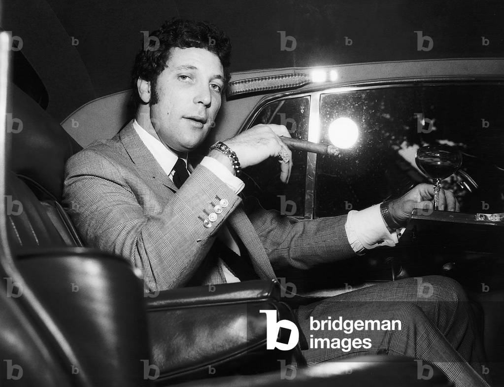 Tom Jones Singer on his way to Luton in a car, c. 1972 (b/w photo)