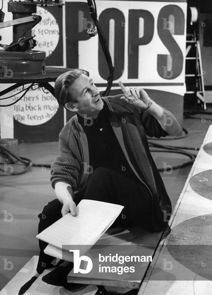 50th top of the pop show, BBC TV Studios, Mr Producer Johnnie Stewart at work on this week's 50th show, December 1964 (b/w photo)