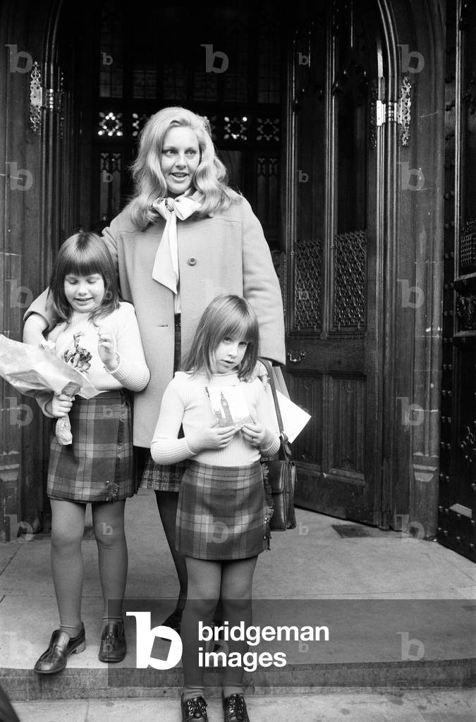 Mrs Margo MacDonald, of the Scottish National Party, MP for Glasgow Govan arrived in London today to take her seat at the House of Commons. With her were her two children, Zoe (6) and Petra (8). 22nd November 1973 (b/w photo)