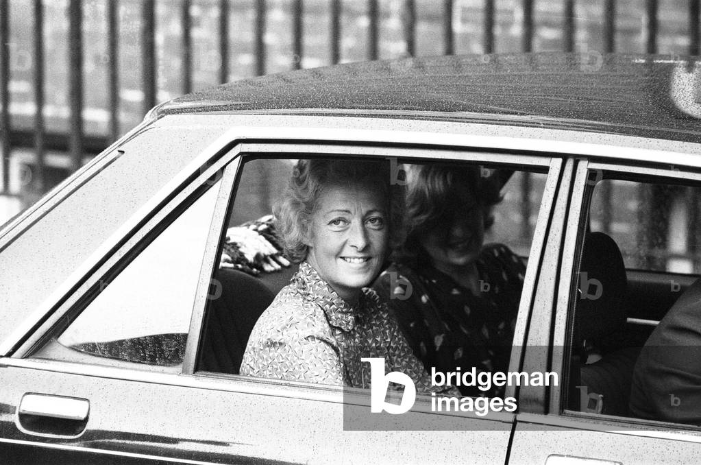Frances Shand Kydd, proud mother of Princess Diana, Princess of Wales, leaves St Mary's Hospital, London after visiting her daughter and new grandson, Prince William, pictured with Lady Jane Fellowes, Diana's sister, Wednesday 22nd June 1982 (b/w photo)