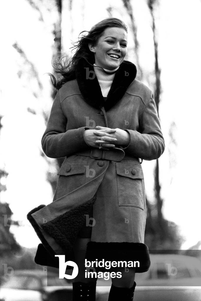 A model wearing a winter coat during a fashion shoot, 26th October 1971 (b/w photo)