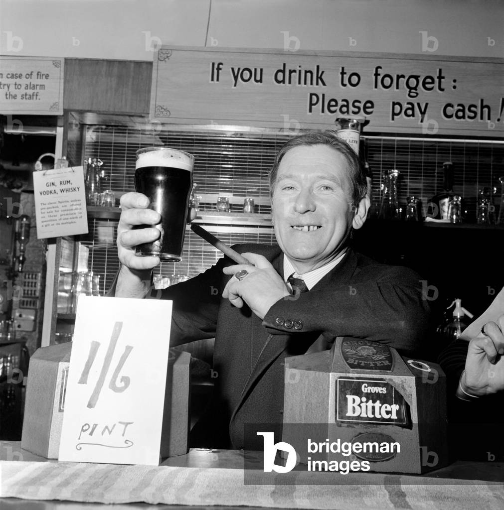 Drinking Pubs. Licencee of the Jubilee Inn at White Lane, Salford, Mr. Sidney Harrison, says 'cheers' to his customers as he raises his pint to toast the launching of his cut-price drinks plan. November 1969
