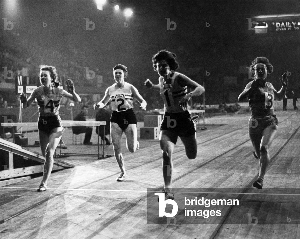Finish of womens' 60 yards. L to R - M. Dew, C. Bailey, D. Arden, and M. Cobb, Anden came first, Cobb 2nd and Dew 3rd. March 1962