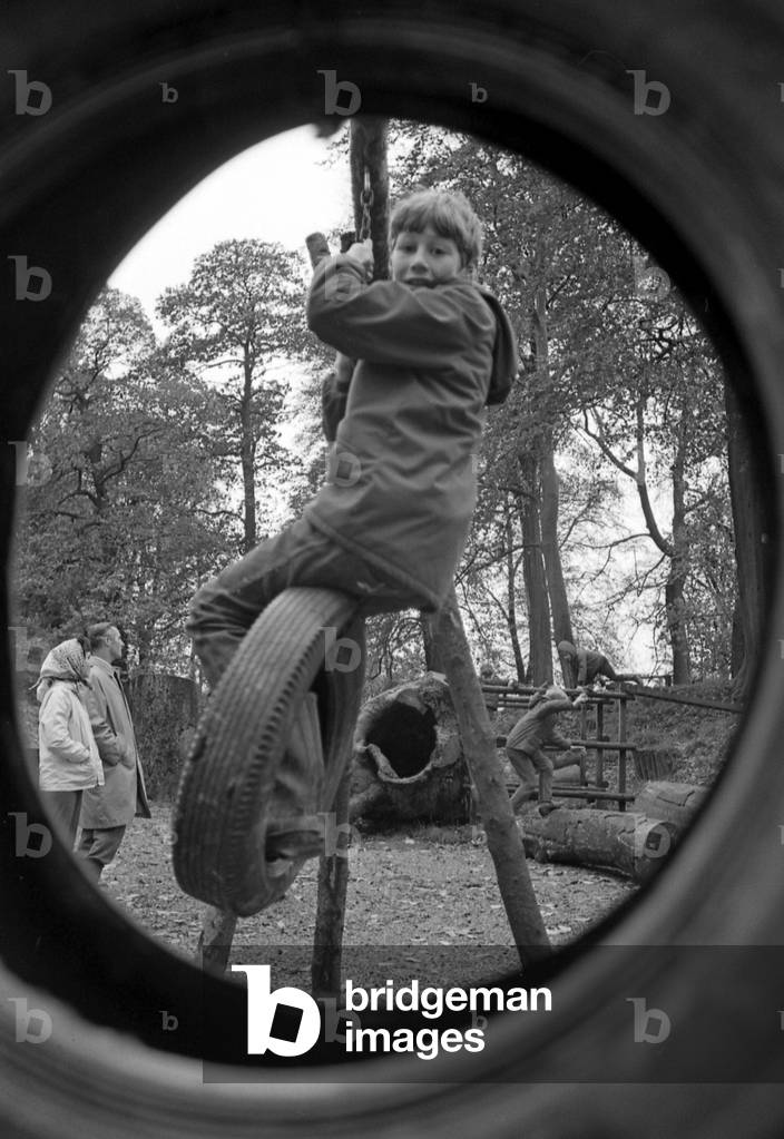 Enthusiastic youngsters make full use of the new adventure playground in Priory Park which was officially opened on Saturday by the Mayor of Warwick, Councillor Dennis Grimes. /the ceremony was attended by members of Warwick Rotary Club, including the president, Mr. Anthony Butcher, and members of the Borough Council. The club held several fundraising functions to raise the £300 for the project, which is considered a welcome additional amenity for children who play in the park. 2nd November 1968 (b/w photo)