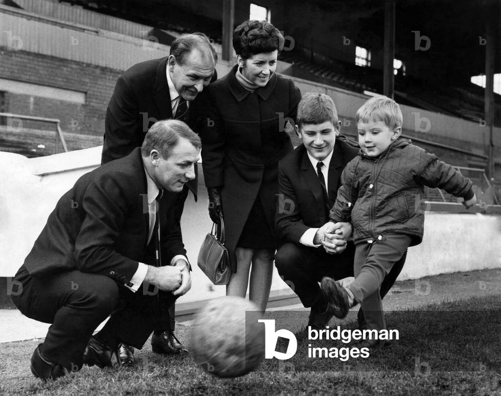Like father. Like big brother three-year-old Peter Docherty shows his shooting prowess. The Docherty family were at Turf Moor yesterday for the signing on professional forms of Michael (17) by Burnley. November 1967 (photo)