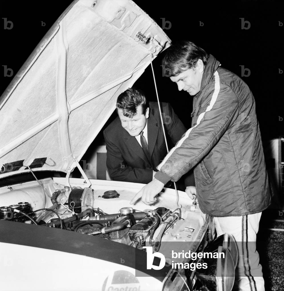 Sport - Motor. Rally racing. Sgt. Wally Eastern, is shown the Engine of Roger Clark's Ford. 
November 1969