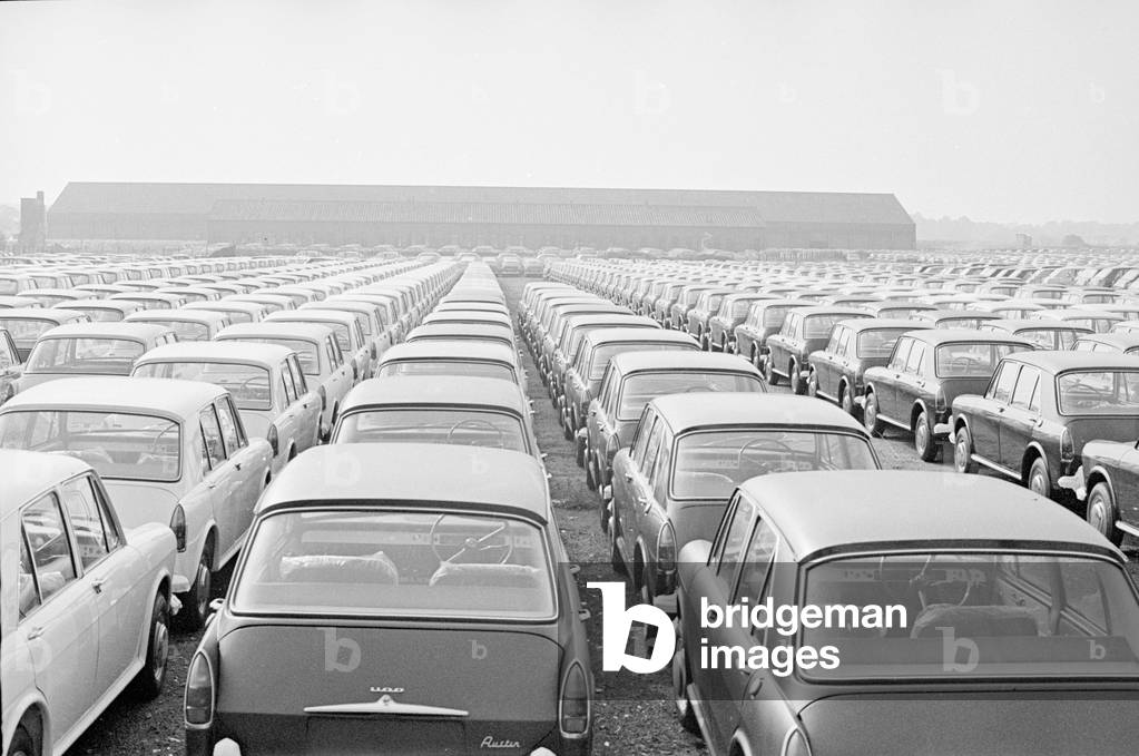 Thousands of new produced Austin cars stored on Wythnal Airfield shortly after coming off the production line at Longbridge, Birmingham, 2nd October 1966 (b/w photo)