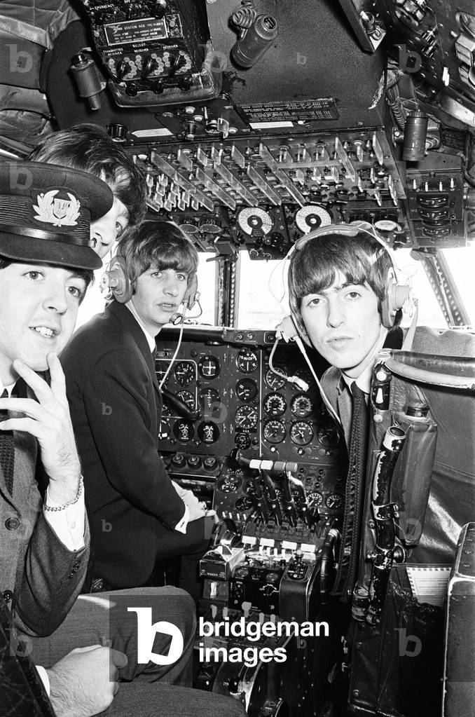 The Beatles in Liverpool for the Premier of a Hard Day's Night.
Ringo Starr, George Harrison and Paul McCartney pictured here in the cockpit of the plane on their flight to Liverpool. 10th July 1964.