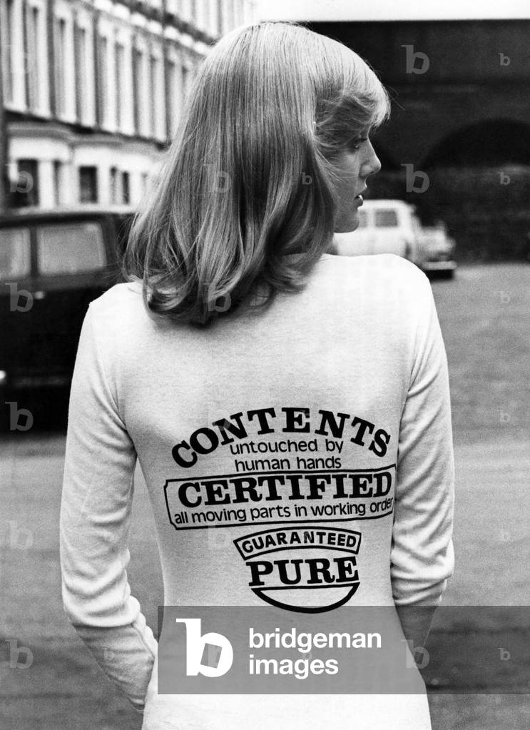 Fashion - 1970's: Tee hee Shirts. Some people will wear anything for laughs. That's why the T-shirt has become the Tee hee shirt. For trendies with an eye to a quick sale have turned it into a top-selling giggle garment with fun designs all the rage. The man behind many of the designs is Bob Lange, 28, who runs a business with his brother in North London. He said: 