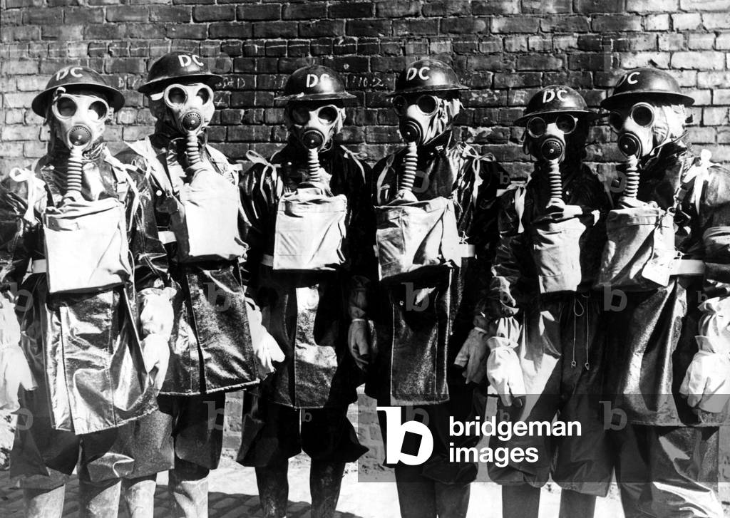 Newcastle Chronicle and Journal staff wearing gas masks as part of air raid precautions (A R P) training. Air Raid Wardens, c. 1940 (b/w photo)