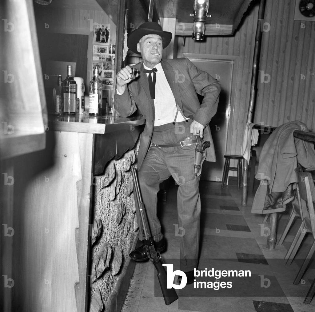 Cowboy mad miner Lot Beedon aged 63 gets a slug of rotgut at the local saloon in Wombwell, November 1969