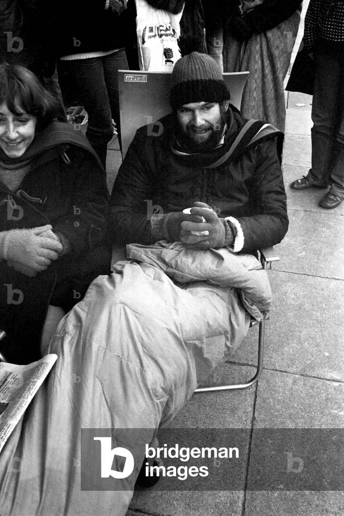 Elton John fans spent the night in sub-zero temperatures to make sure of getting tickets for the superstars concerts at Newcastle City Hall. 40 campers had taken their places on the steps in advances of Elton's March 22nd and 23rd gigs. 2nd February, 1979 (b/w photo)