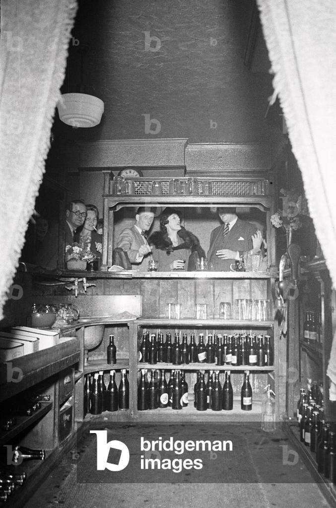 Power cut at a Hampstead Pub circa July 1947 (b/w photo)