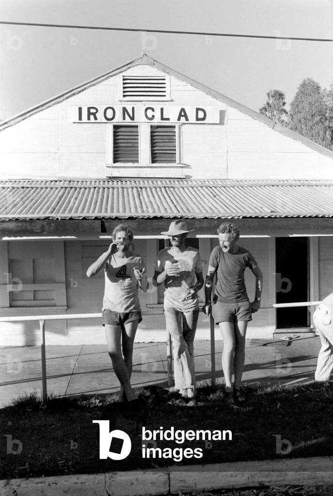 Marble Bar Western Australia: Ironclad hotel with its corrugated iron roof and some of the customers outside, April 1977 (b/w photo)