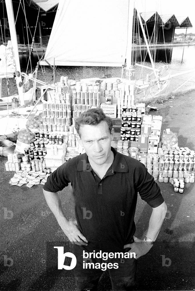 Robin Knox-Johnson with his provisions he will take on his yacht 'Suhaili' when he sails around the world single-handedly in the Sunday Times Golden Globe Round The World Yacht race. May 1968 (b/w photo)