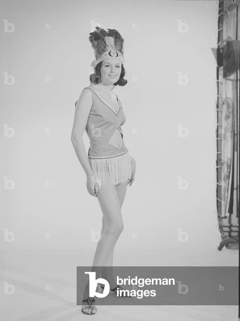 Reveille Fashion Feature Reveille Model Gloria Janes seen here modelling red Indian fashion December 1963 (b/w photo)