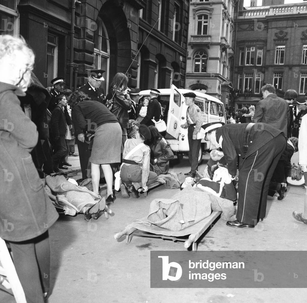 Police try to control fans in the streets of Liverpool before the premiere of The Beatles film 