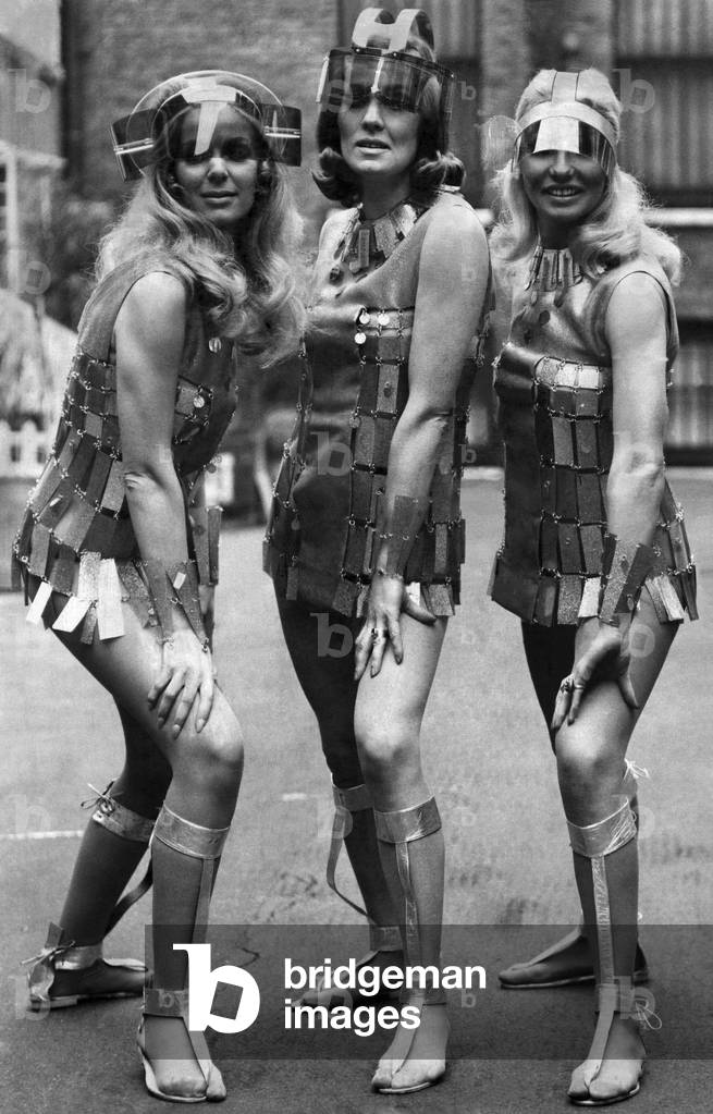 Eyes and blindness glasses-Sunglasses: If, of when the sun comes out in the year 2000, this is what the well-dressed girl about space will be wearing - a futuristic mini-dress and, more to the point supersunspecs. At least, that's what was suggested at the Sunglasses Fair in London yesterday. These visor-type versions are called, from left to right, Orbit, Lunanaut and Executive 2000. The girls wearing them are called Valerie St. John, Bunty Garland and Stevie Vaughan. And they are young enoung to be around 31 years from now to see if the designers are proved right. February 1969