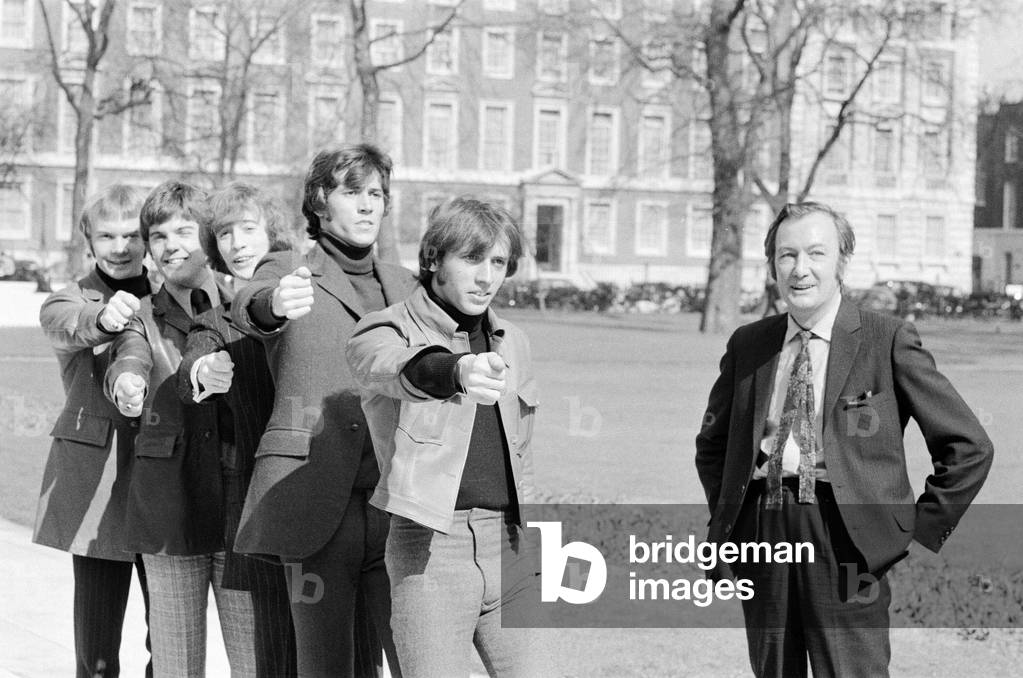 Johnny marches The Bee Gees through London as he gives them a taste of what's to come, 29th March 1968 (b/w photo)