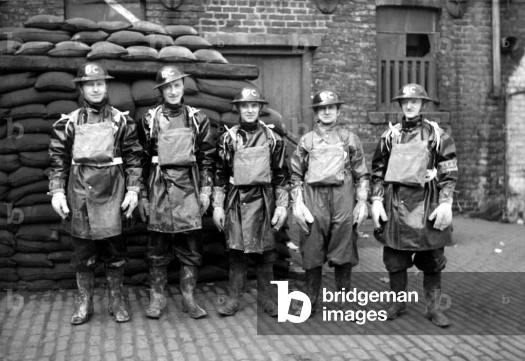 Newcastle Chronicle and Journal staff wearing gas masks as part of air raid precautions (A R P) training. Air Raid Wardens, c. 1940 (b/w photo)