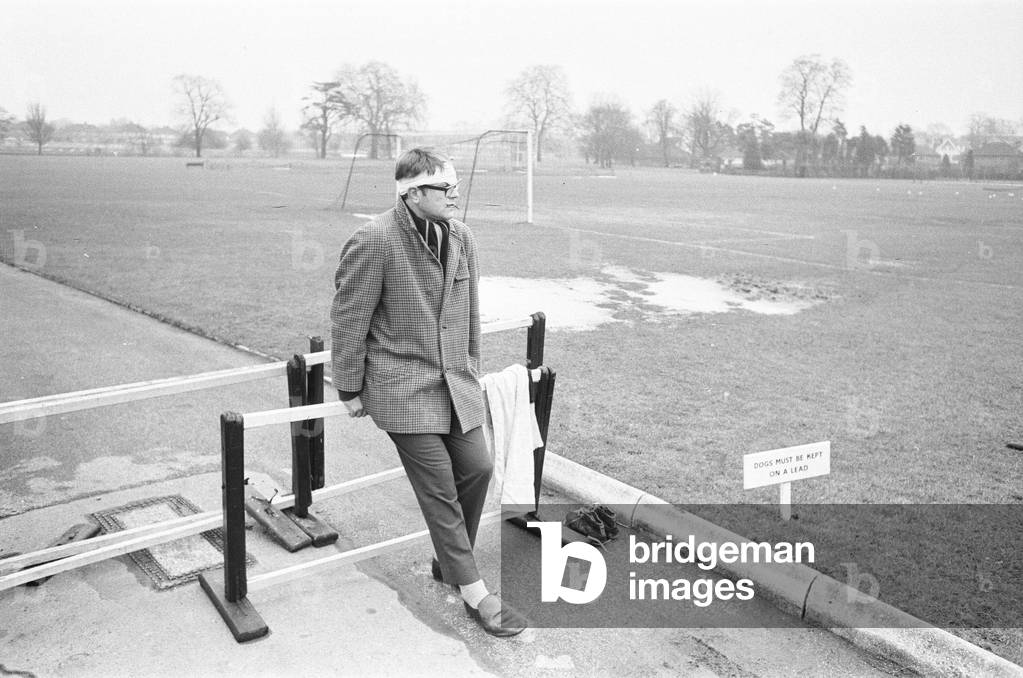Injured England Skipper Dick Greenwood looks on as the rest of the England Rugby Union team train 21st February 1969 (b/w photo)