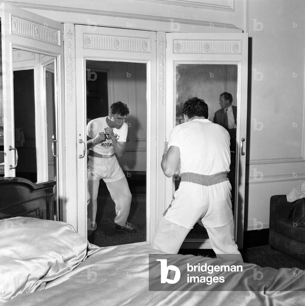 Terry Downs - Boxer: Terry Downs works out in his bedroom at Manchester's Midland Hotel for his fight at Belle Vue tomorrow night. June 1960