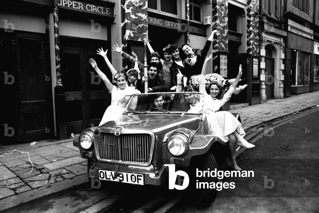 Newcastle University students on a photo call outside the New Tyne Theatre, Westgate Road, Newcastle on 29th February 1984 (b/w photo)