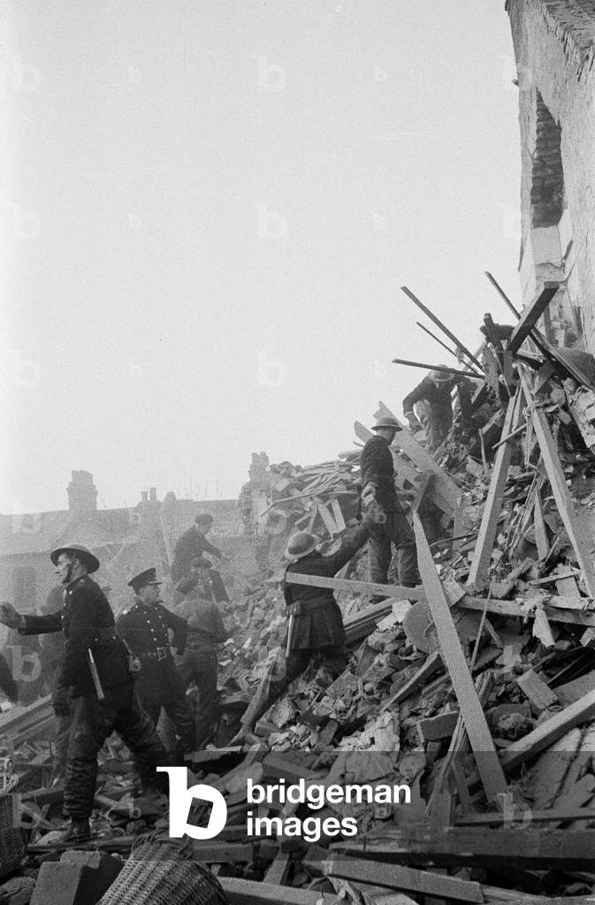 V2 Rocket incident at Farrant Avenue, Lordship Lane, Wood Green. Dogs helping search for survivors. 3rd March 1945 (b/w photo)