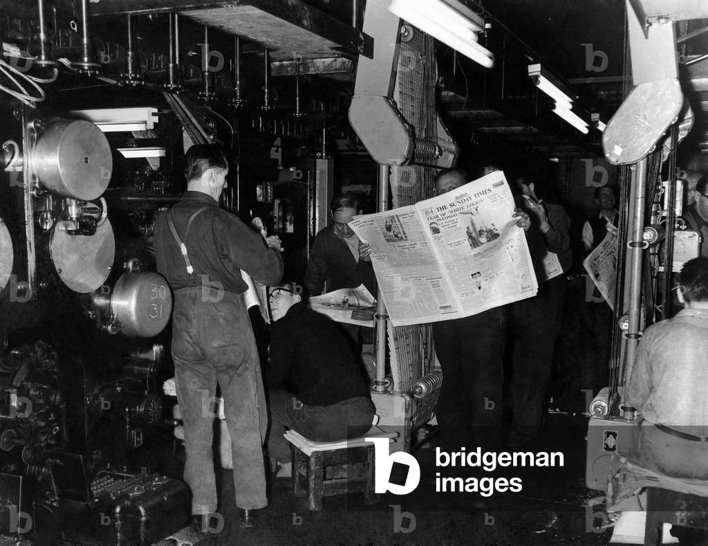 Thomson House. London. The first copies of the Sunday Times off the presses Here seen machine men looking at first copies from the presses. January 1961
