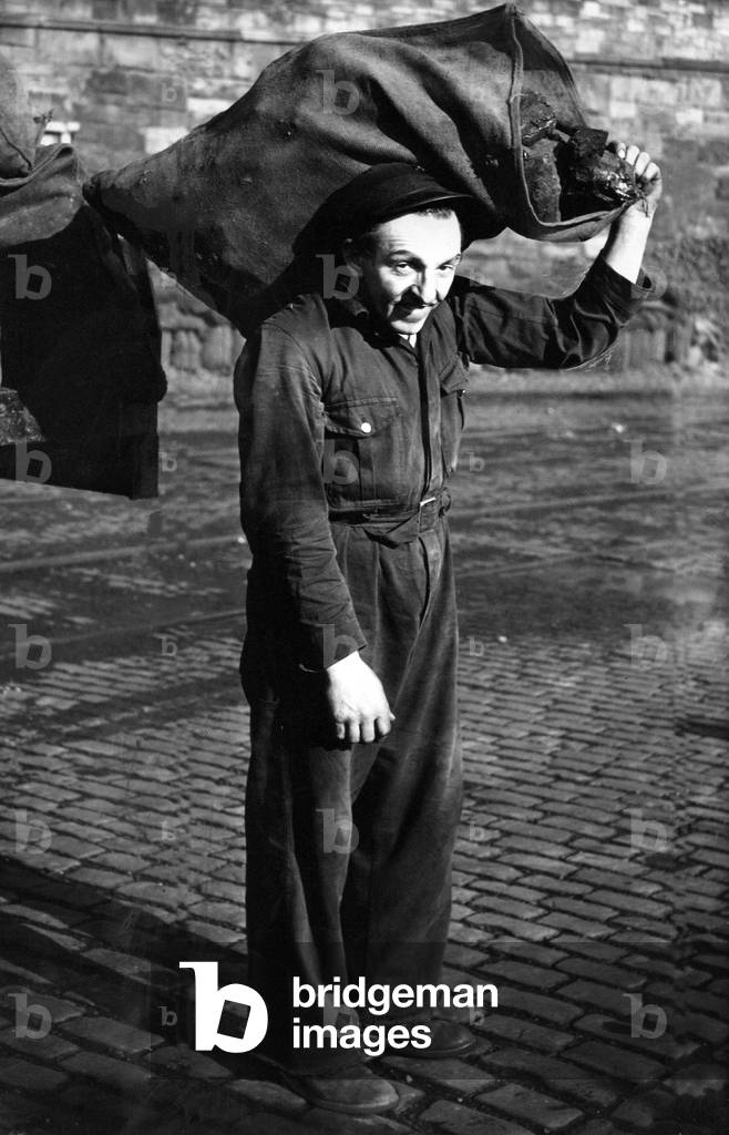 Coalman Robert Scott humping bags of coal for a living, c. 1960