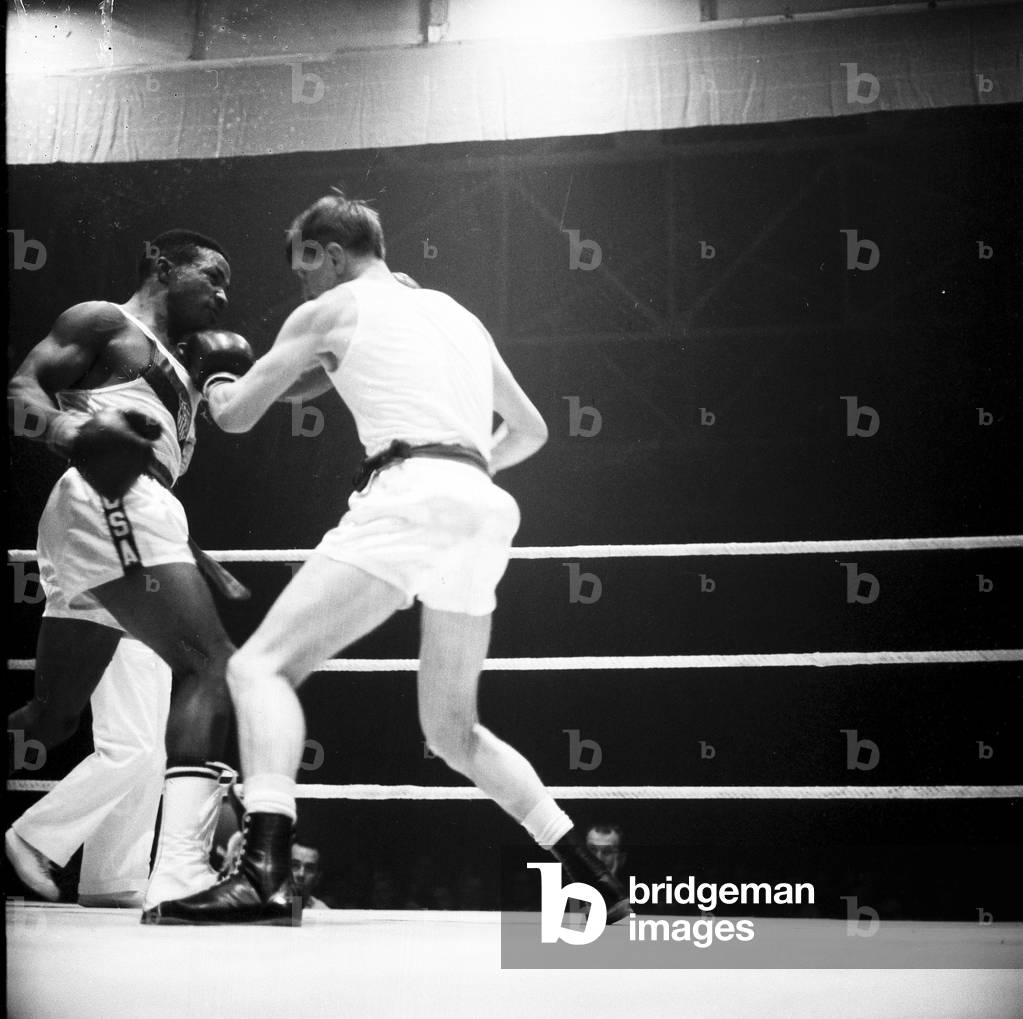 Amateur boxing match between the USA and England at Wembley. Action from the bout between Johnny Cesspooch (USA) and Peter Benneyworth (England) 2nd November 1961 (b/w photo)