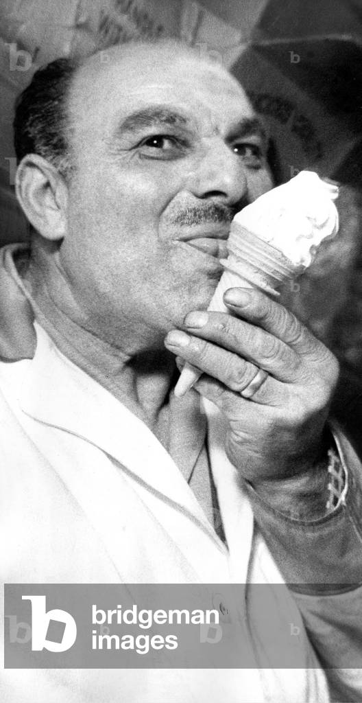 The new crowned king of the ice cream men Mr. Nichol Rea is celebrating after his ice cream was judged the best in Britain in October 1965 (b/w photo)